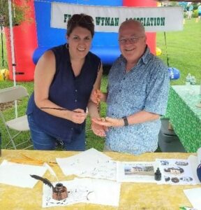 Pam M. and Jon W. at the Celebrate Burlington Wyman booth